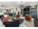 Open-concept living area flows into kitchen, featuring a fireplace and modern decor at 148 Canton St, Alpharetta, GA 30009