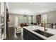 Bright, open-concept living room and kitchen with contemporary decor and hardwood floors at 148 Canton St, Alpharetta, GA 30009