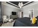 Spacious main bedroom featuring a media center and ample natural light from the shuttered window at 148 Canton St, Alpharetta, GA 30009