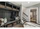 Functional mudroom featuring custom bench seating with storage and convenient coat hooks at 148 Canton St, Alpharetta, GA 30009