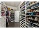 Organized walk-in closet featuring custom shelving, shoe racks, and ample storage for clothes and accessories at 148 Canton St, Alpharetta, GA 30009