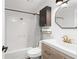 This full bath offers a shower and tub combination with a stylish wood vanity at 210 Walker Sw St # 3, Atlanta, GA 30313