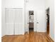 Hallway featuring hardwood floors, a closet, and views to the bathroom and main living area at 210 Walker Sw St # 3, Atlanta, GA 30313