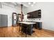 Modern kitchen with stainless steel appliances, wooden floors, and a kitchen island at 210 Walker Sw St # 3, Atlanta, GA 30313