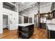 Modern kitchen with stainless steel appliances, a kitchen island, and exposed ductwork at 210 Walker Sw St # 3, Atlanta, GA 30313