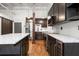 Contemporary kitchen with stainless steel appliances, an island, and wooden floors at 210 Walker Sw St # 3, Atlanta, GA 30313