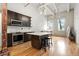 Modern kitchen featuring stainless appliances, a center island with bar stools, and abundant natural light at 210 Walker Sw St # 3, Atlanta, GA 30313