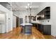 Modern kitchen with stainless steel appliances, an island, and an in-unit washer and dryer at 210 Walker Sw St # 3, Atlanta, GA 30313