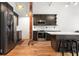 Modern kitchen with stainless steel appliances, a central island, and a wooden floor at 210 Walker Sw St # 3, Atlanta, GA 30313