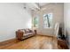 Bright living room featuring hardwood floors, high ceilings, and large windows with natural light at 210 Walker Sw St # 3, Atlanta, GA 30313