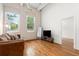 Bright and airy living room with hardwood floors, natural light, and comfortable seating at 210 Walker Sw St # 3, Atlanta, GA 30313