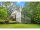 Exterior of home featuring a deck, walkout basement, lush yard, and stairs at 345 Jesse Martin Trl, Canton, GA 30115