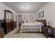 Spacious bedroom with a fan, natural light, and neutral decor creates a peaceful retreat at 345 Jesse Martin Trl, Canton, GA 30115