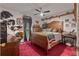Unique bedroom with vintage décor and red carpet creates a one-of-a-kind living space at 345 Jesse Martin Trl, Canton, GA 30115