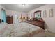 Bright bedroom features a dresser, guitars, and large, inviting bed at 345 Jesse Martin Trl, Canton, GA 30115