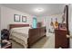 Charming bedroom with natural light, dresser, guitars, and a comfortable bed at 345 Jesse Martin Trl, Canton, GA 30115