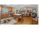 Spacious kitchen featuring wood cabinets, an island with seating, and an adjoining dining area at 345 Jesse Martin Trl, Canton, GA 30115