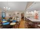Well-lit kitchen and dining area featuring a kitchen island with barstool seating at 345 Jesse Martin Trl, Canton, GA 30115
