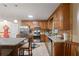 Kitchen area showcasing stainless steel appliances, cabinetry, and a skylight at 345 Jesse Martin Trl, Canton, GA 30115