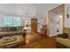 Inviting living room featuring hardwood floors, natural light, and ample seating at 345 Jesse Martin Trl, Canton, GA 30115