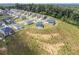 An aerial view shows new construction homes on landscaped lots, nestled in greenery at 3455 Jasmine Sw Way, Atlanta, GA 30331