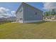 Expansive backyard with green lawn, patio and a view of the home's exterior at 3455 Jasmine Sw Way, Atlanta, GA 30331