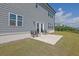 Serene backyard featuring a concrete patio, well-maintained lawn, and a view of the surrounding landscape at 3455 Jasmine Sw Way, Atlanta, GA 30331