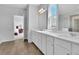 Bathroom featuring double sinks, and an elegant mirror at 3455 Jasmine Sw Way, Atlanta, GA 30331