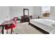 Bright bedroom with a twin bed, desk, and a large window offering natural light at 3455 Jasmine Sw Way, Atlanta, GA 30331
