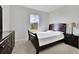 Cozy bedroom with dark furniture, neutral walls, and a carpeted floor at 3455 Jasmine Sw Way, Atlanta, GA 30331