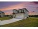 Two-story home with two car garage and beautiful lawn at 3455 Jasmine Sw Way, Atlanta, GA 30331