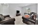Spacious living room with plush sofas, a flat-screen TV, and a bright window at 3455 Jasmine Sw Way, Atlanta, GA 30331