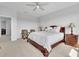 Spacious main bedroom with plush carpet and a ceiling fan at 3455 Jasmine Sw Way, Atlanta, GA 30331