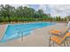 Community pool with multiple lounge chairs and lush landscaping at 3455 Jasmine Sw Way, Atlanta, GA 30331