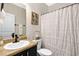 Bathroom featuring a sink, toilet, and shower with decorative accents offering style and functionality at 3975 Silverthorn Trce, Cumming, GA 30028