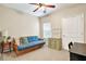 Cozy bedroom with a futon, side table, and a chest of drawers creating a comfortable and inviting space at 3975 Silverthorn Trce, Cumming, GA 30028