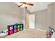 Bedroom featuring vaulted ceiling, door and black storage furniture with colorful bins at 3975 Silverthorn Trce, Cumming, GA 30028