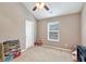 Cozy bedroom with a vaulted ceiling, a window with blinds, and playroom decor at 3975 Silverthorn Trce, Cumming, GA 30028