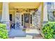 Charming front porch with stone columns and facade, offering a warm welcome to visitors at 3975 Silverthorn Trce, Cumming, GA 30028