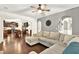 Spacious living area with view into kitchen, light gray walls and decoratively finished archways at 3975 Silverthorn Trce, Cumming, GA 30028