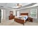 Spacious main bedroom with large bed, lots of natural light and en-suite bathroom access at 3975 Silverthorn Trce, Cumming, GA 30028