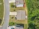 Aerial view of a well-maintained home with a manicured lawn and surrounding greenery at 6065 Crescent Landing Dr, Cumming, GA 30028