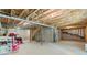 Unfinished basement offering potential for customization and expansion with exposed ceiling beams and plumbing at 6065 Crescent Landing Dr, Cumming, GA 30028