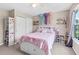 Bedroom featuring carpet flooring, ceiling fan, and bright decor at 6065 Crescent Landing Dr, Cumming, GA 30028