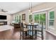 Eat-in kitchen features recessed lighting, bay windows, and sliding glass doors to outdoor deck at 6065 Crescent Landing Dr, Cumming, GA 30028
