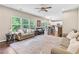 Open concept living room featuring lots of natural light and views of the backyard at 6065 Crescent Landing Dr, Cumming, GA 30028
