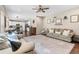 Spacious living room in open concept home featuring kitchen and dining area at 6065 Crescent Landing Dr, Cumming, GA 30028