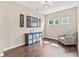 Well-lit living space with hardwood floors, stylish decor, and ample space for relaxation at 6065 Crescent Landing Dr, Cumming, GA 30028