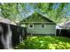 Green house backyard with a wooden privacy fence at 905 Gaston Sw St, Atlanta, GA 30310