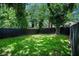 Expansive backyard with lush lawn and privacy fence, perfect for outdoor activities at 905 Gaston Sw St, Atlanta, GA 30310